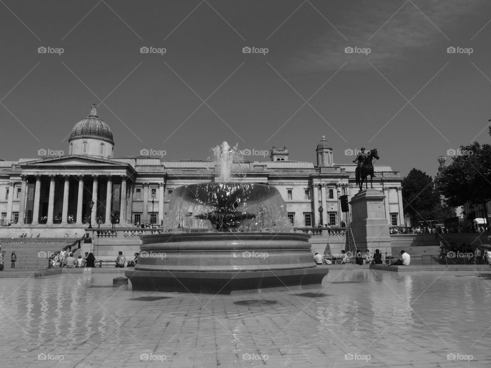 A beautiful fountain in a square in London on a sunny summer day. 