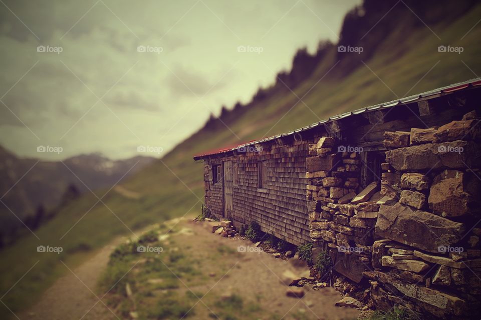 the old cottage. an old weathered cottage in the mountains
