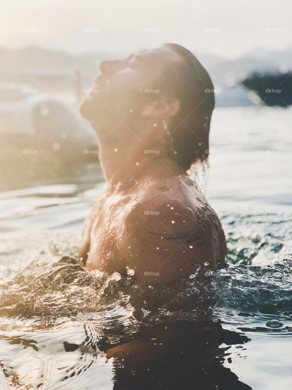 I would like describe this photo swimming pool bath a man relax mind