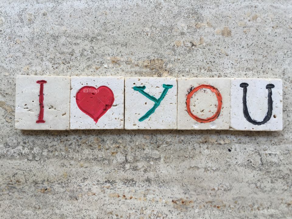 I love you. Love message on carved travertine pieces