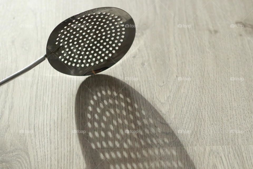 Polka dot shade with slotted spoon