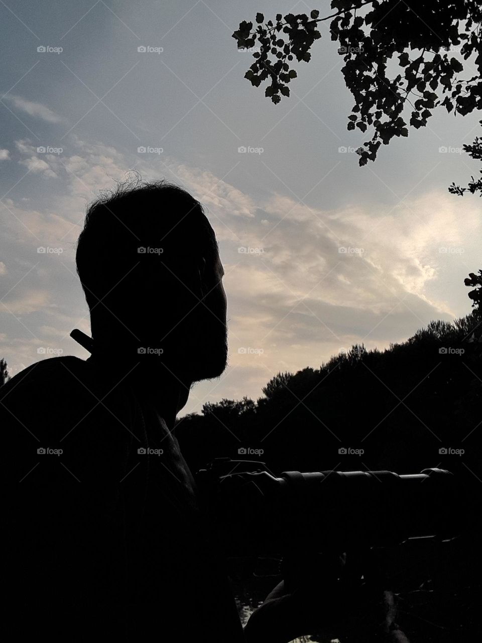 selfie silhouette in the evening taking pics with camera