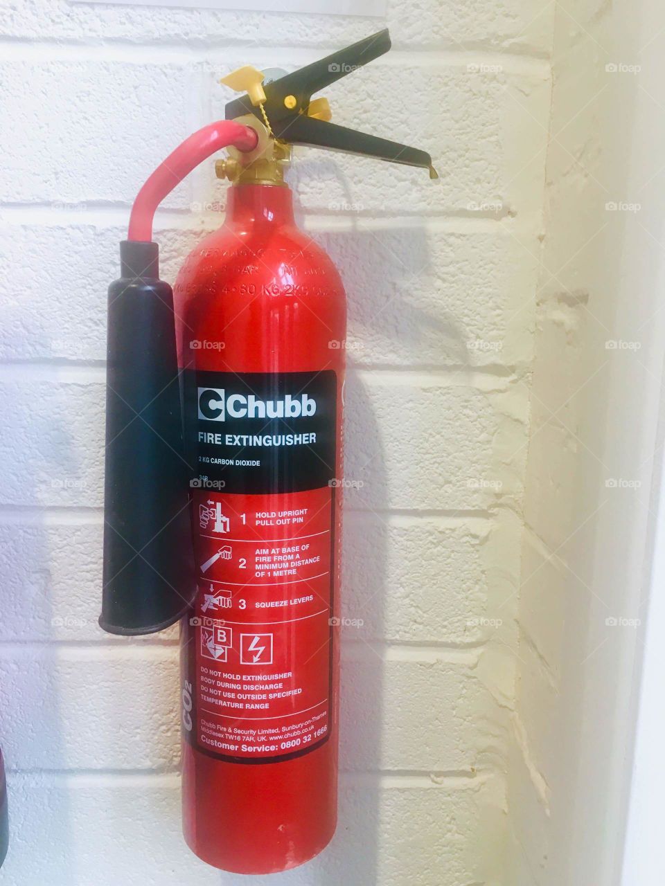 Chubb’s red fire extinguisher on wall