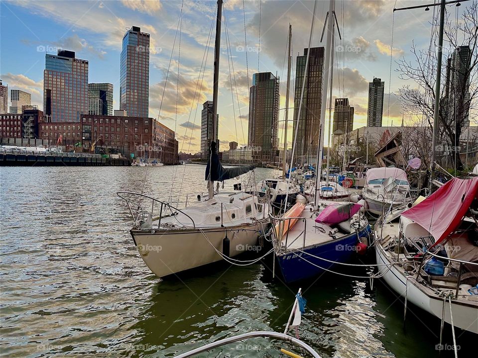 This is “Newtown Creek” by the “Pulaski Bridge” in LIC, Queens with all its beautiful boats that are moored here. The “East River” shimmers in intense shades of silver tonight  emphasized by the reflecting silver clouds. 2024. Hypnotic Productions