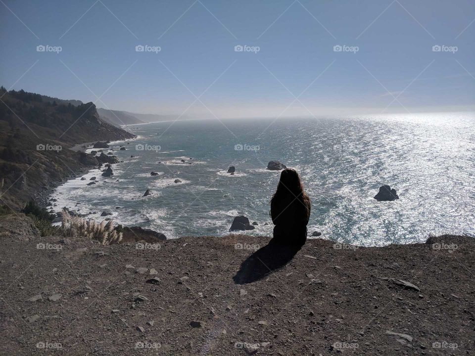 Person (Woman) Staring Out and Gazing Over the Beautiful, Rugged Northern California Coast - Peaceful, Thinking and Meditating
