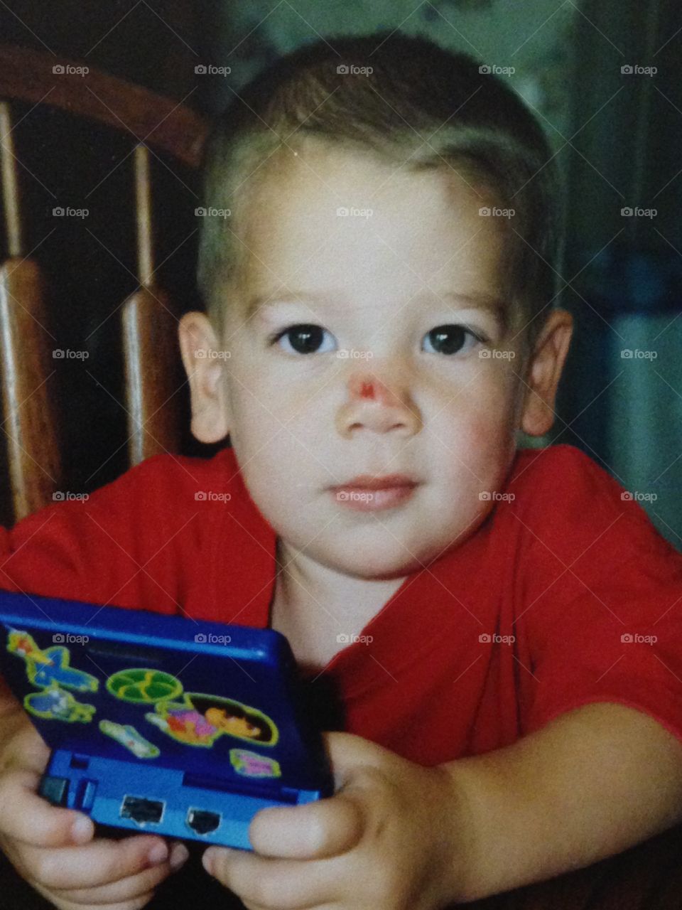 Boy with handheld video game