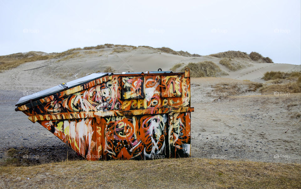 Trash container on the beach.