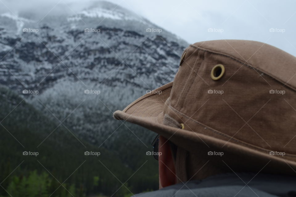 Male photographer shooting nature in Canadian Rocky Mountains 