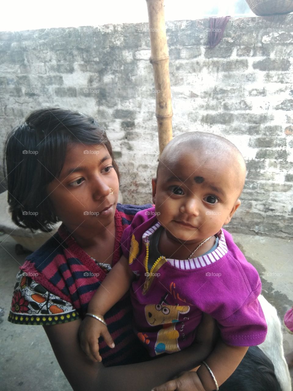 the two child keep other face
