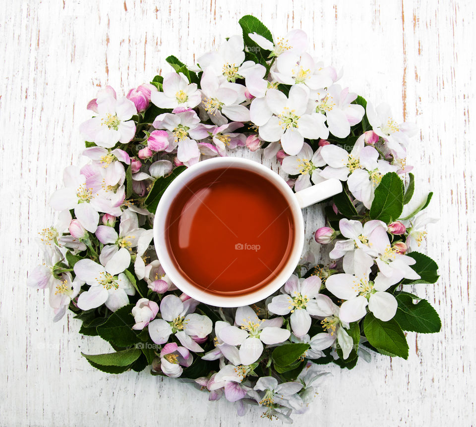 Cup of tea and spring blossom