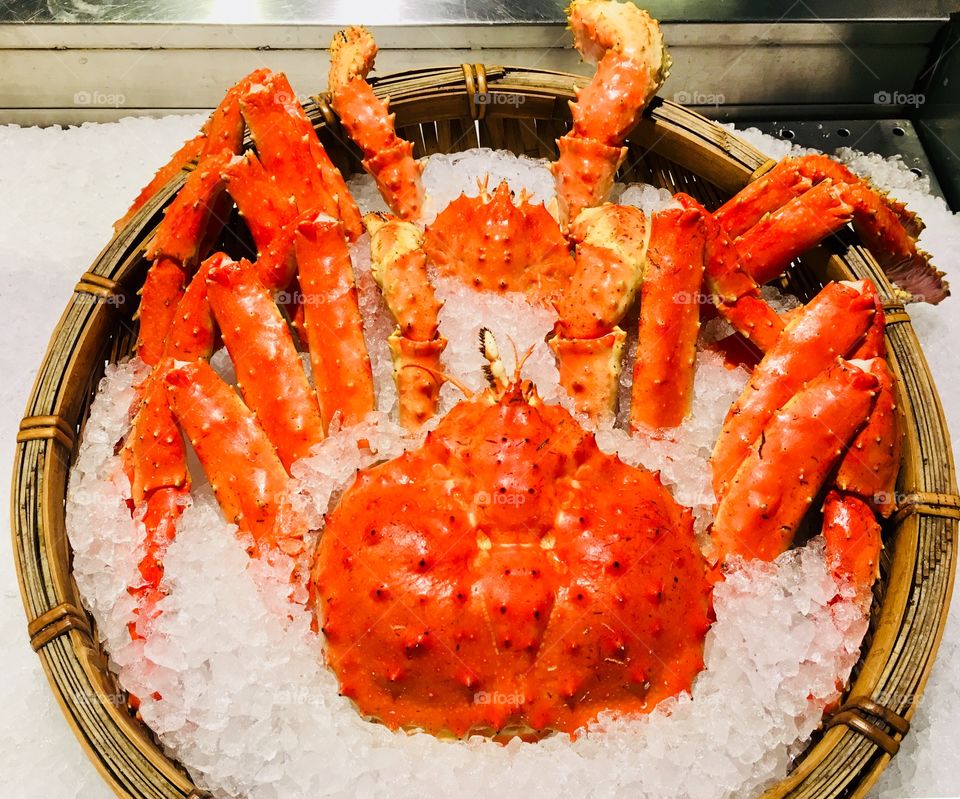 King crab fresh fish market in ice bucket