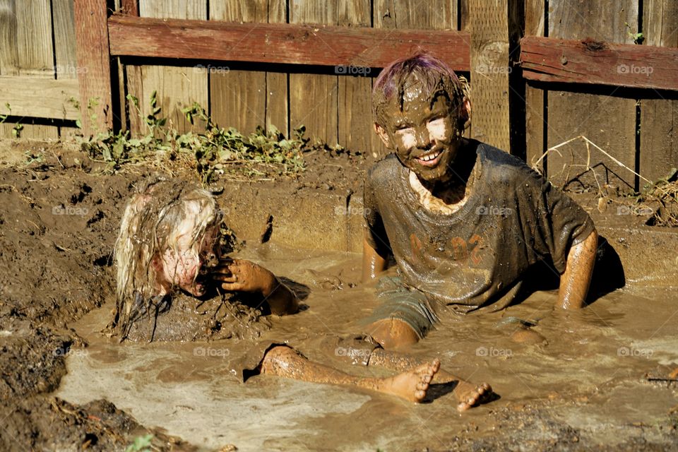 Kids Playing In Mud