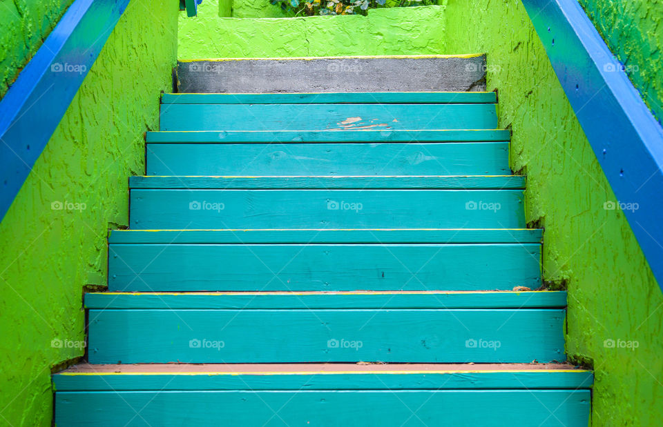 Green painted staircase outdoors