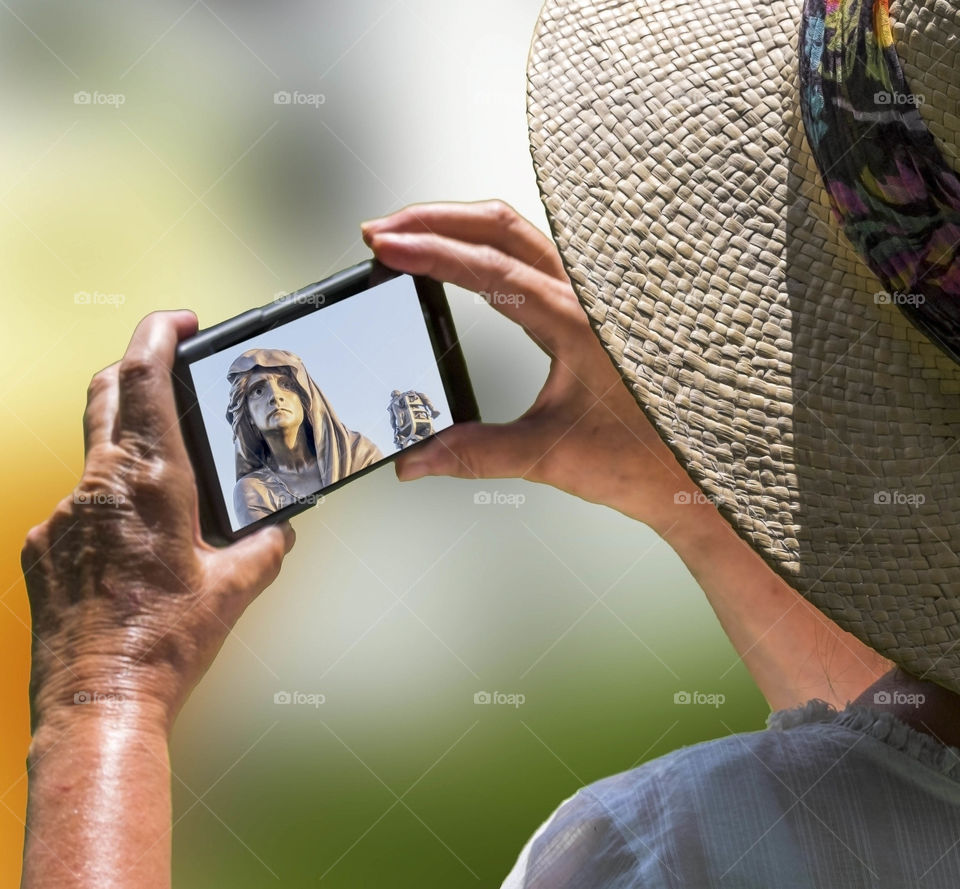 Phone. Camera phoneTourist taking a picture with a smartphone cell phone mobile phone camera 