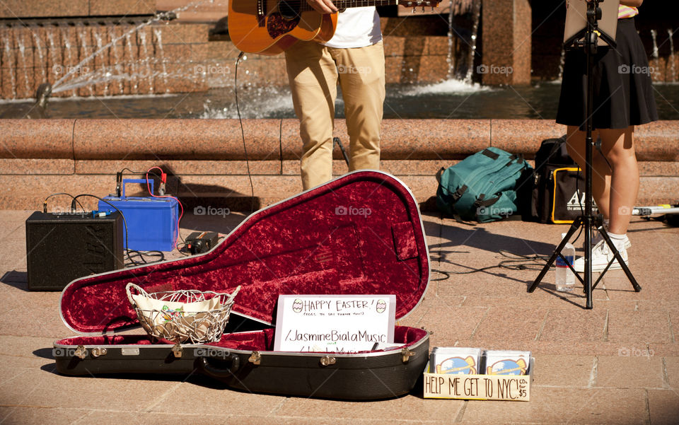 photo story, people playing music at the park for a cause, used guitar case as basket