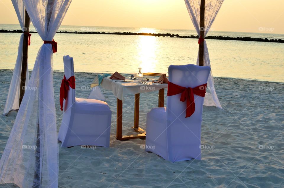 table of the newlyweds on the white beach