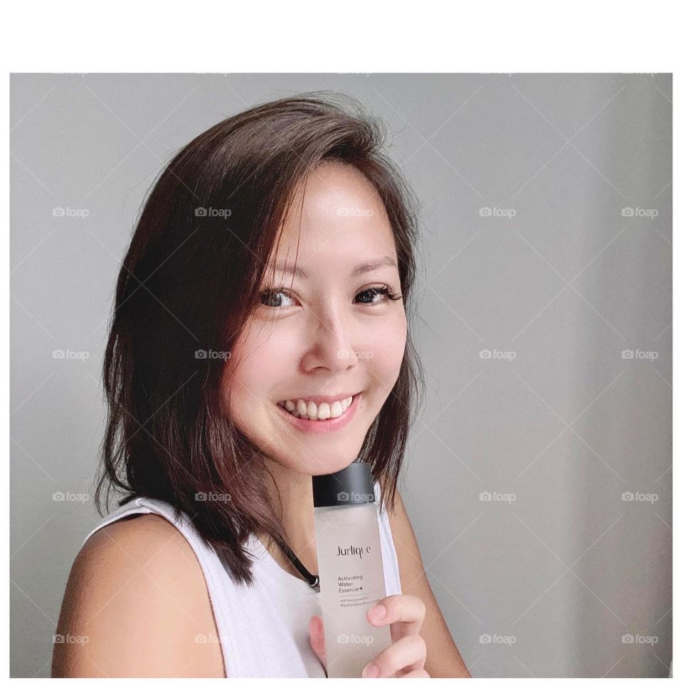 Asian woman with water essence for skin