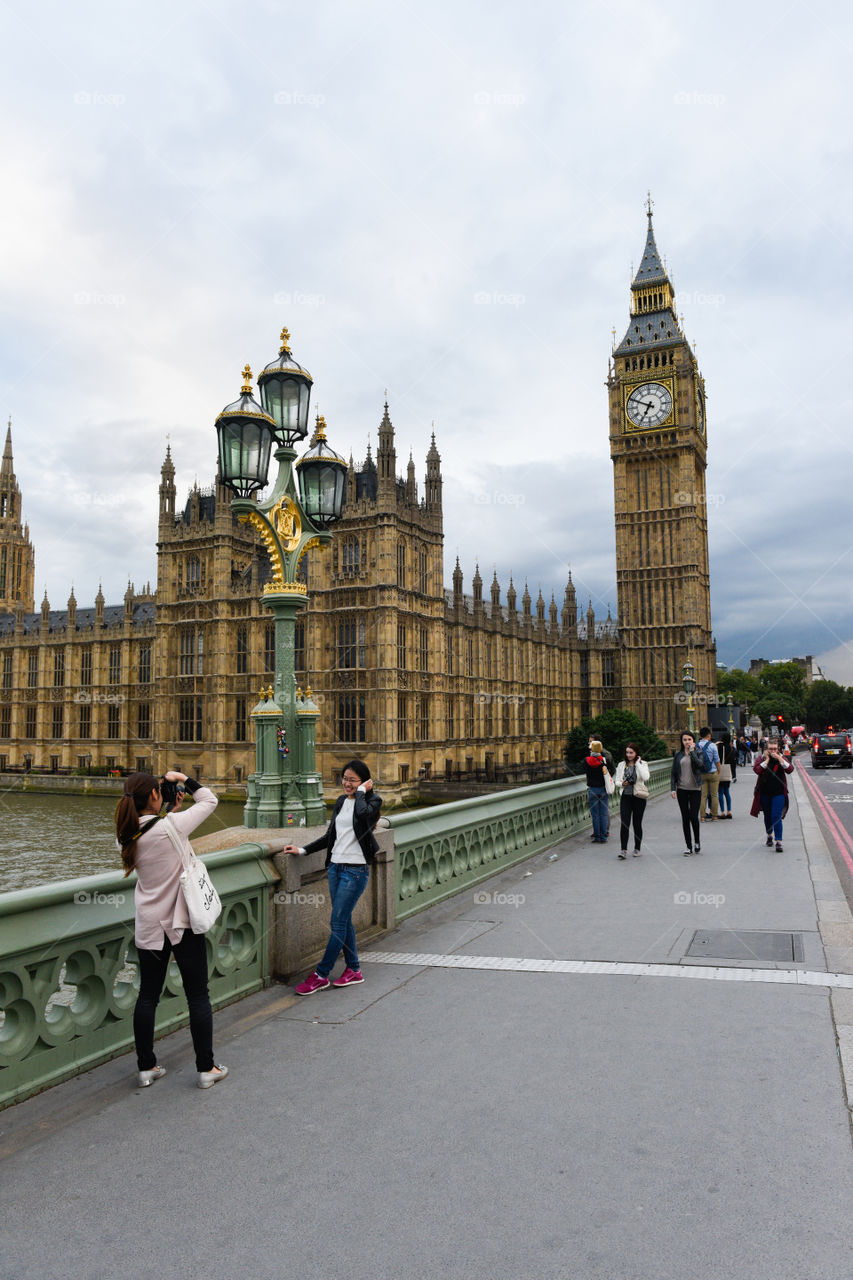 Tourists taking pictures at Big Ben in London.