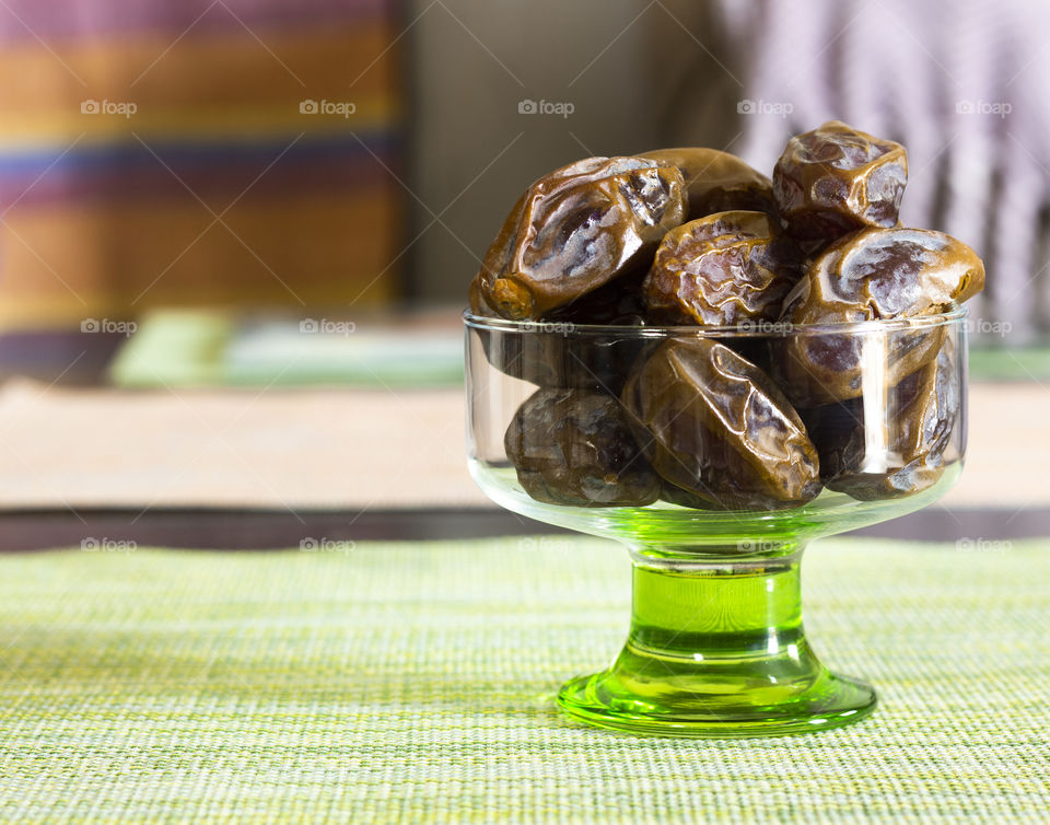 Dates in a green glass