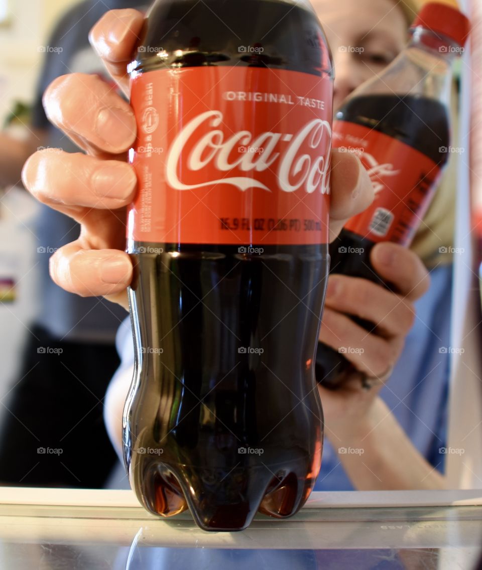 Grabbing some Coca-Cola from the fridge