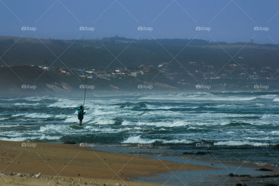 Fisherman Standing In The Shore Break, South Africa