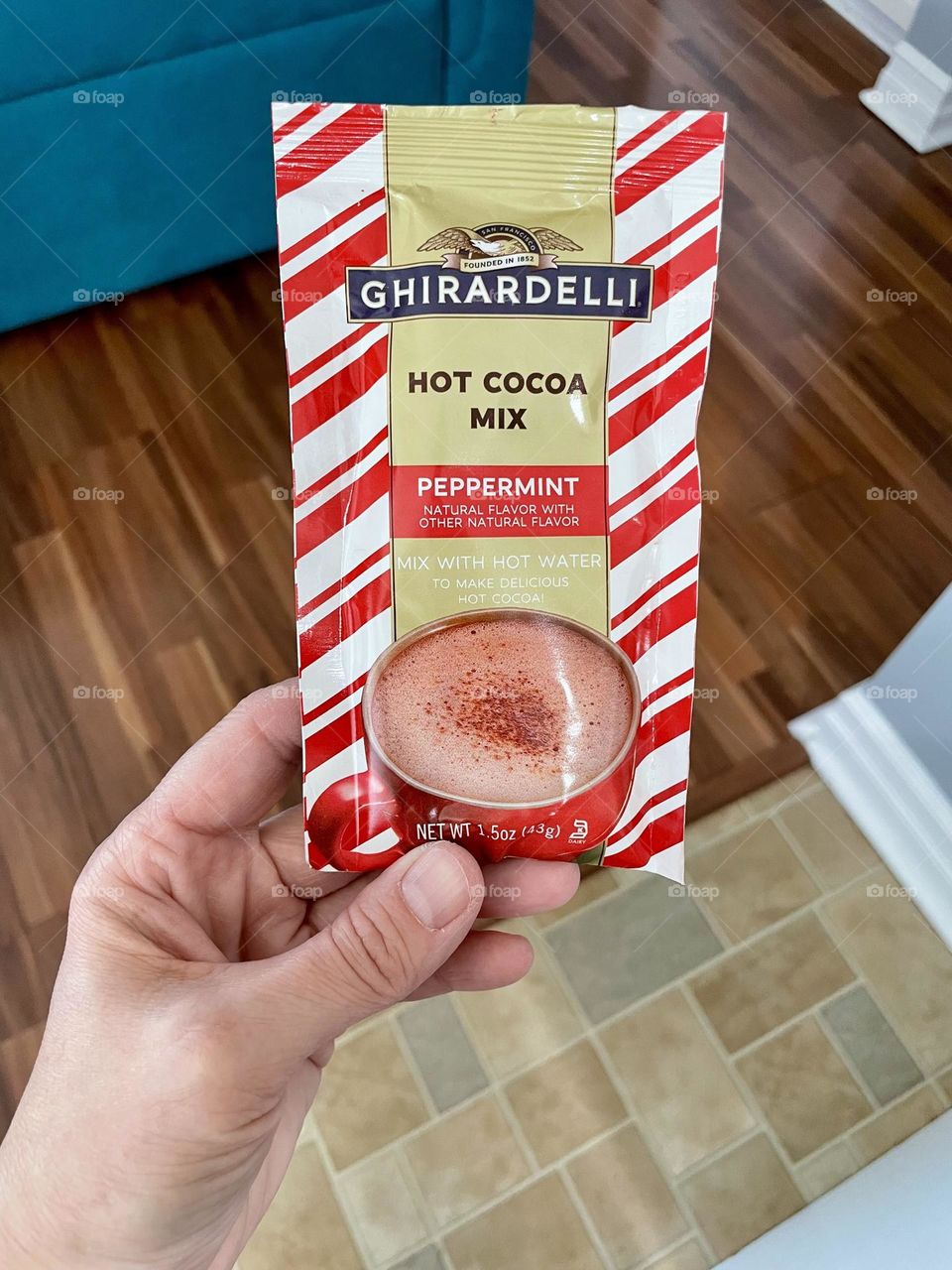 Woman holds hot cocoa mix, getting ready for winter, winter time hot drinks 