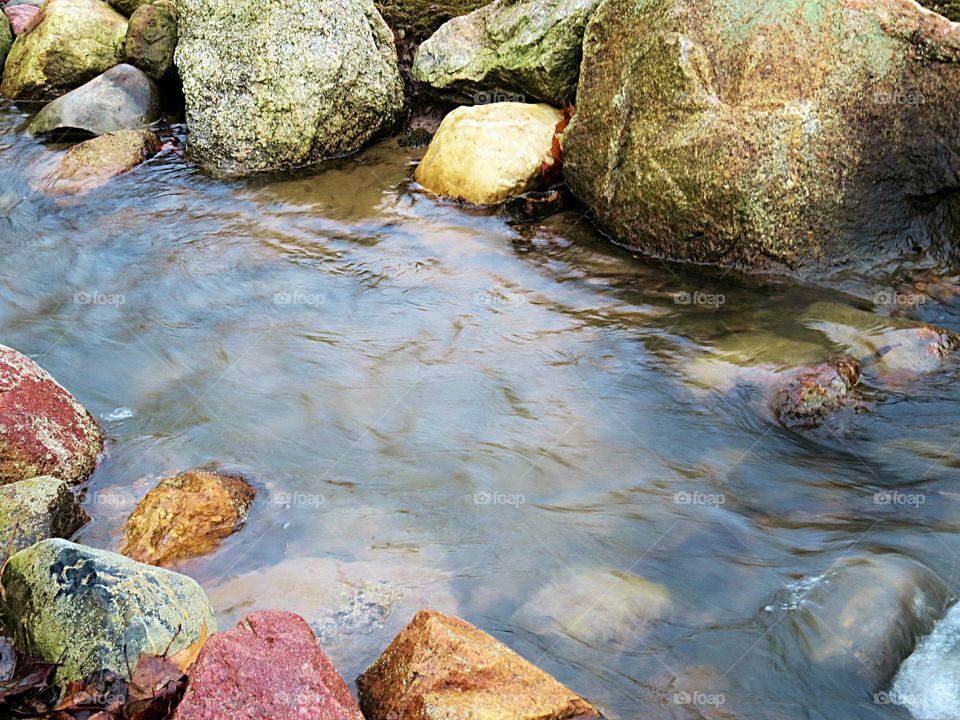 Colorful Boulders and running creek