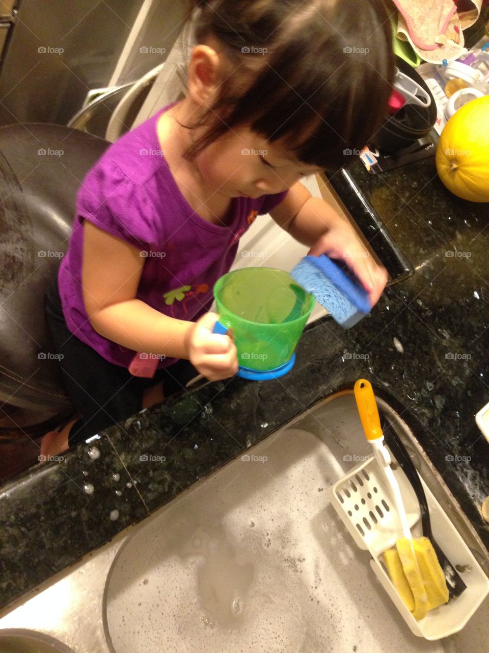 toddler trying to help to clean dishes! it's her first time to wash dishes!