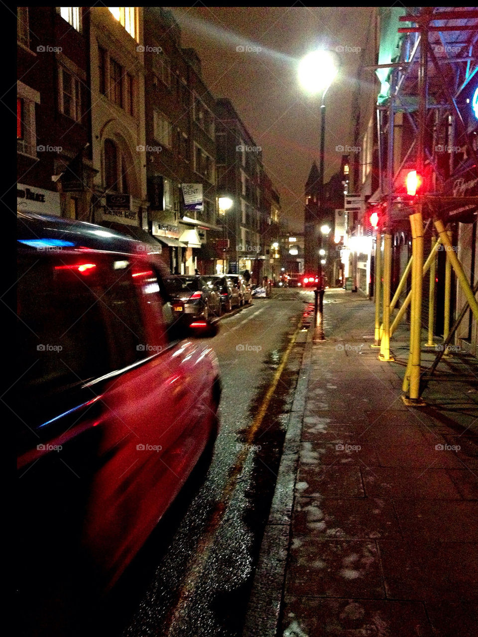 Black cab in late night London.