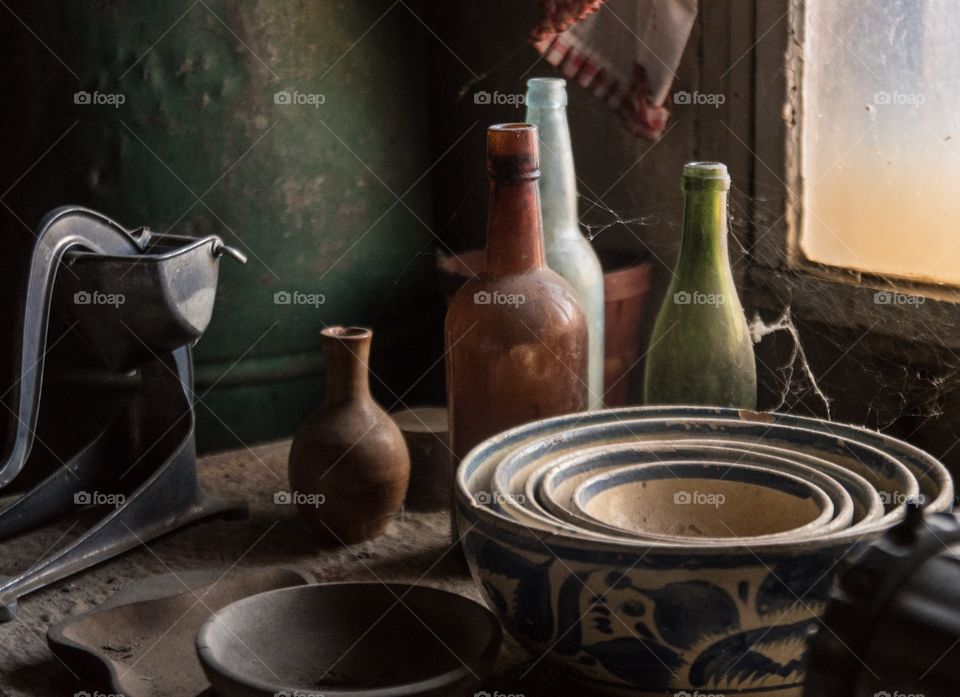 Inside a cabin in Steins Ghost town, kitchen ware on table
