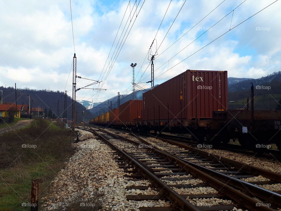 a cargo truck loaded with containers in Nemila