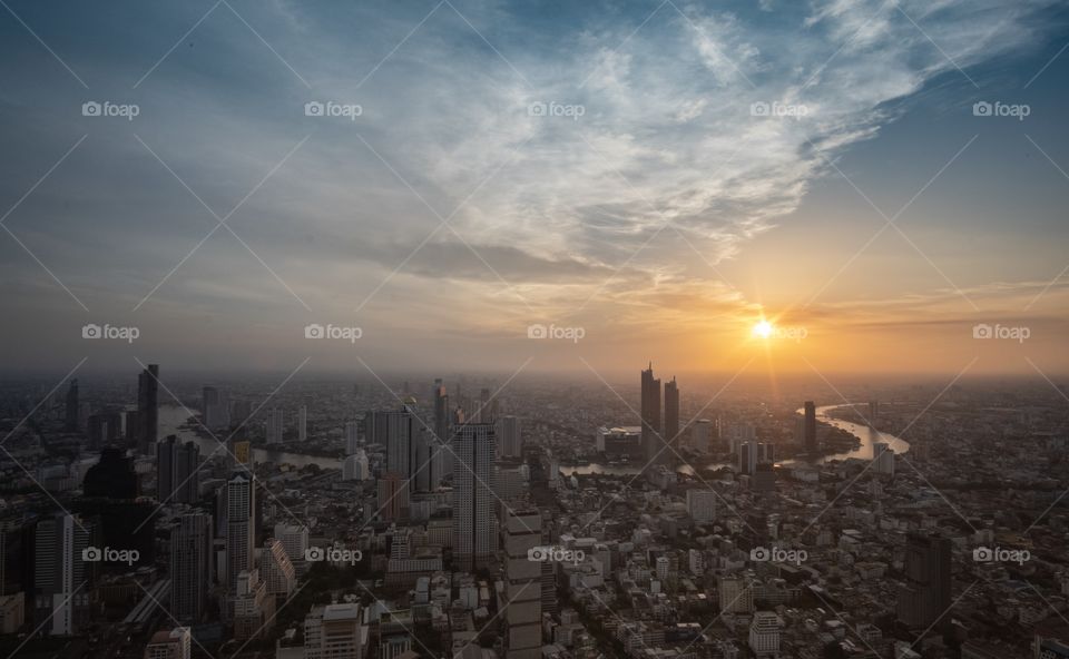 Beautiful sunset scene over capital city scape in Summer , Bangkok Thailand