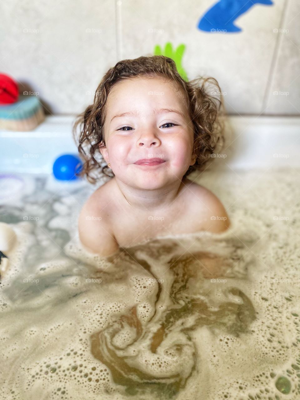Little girl having a bath
