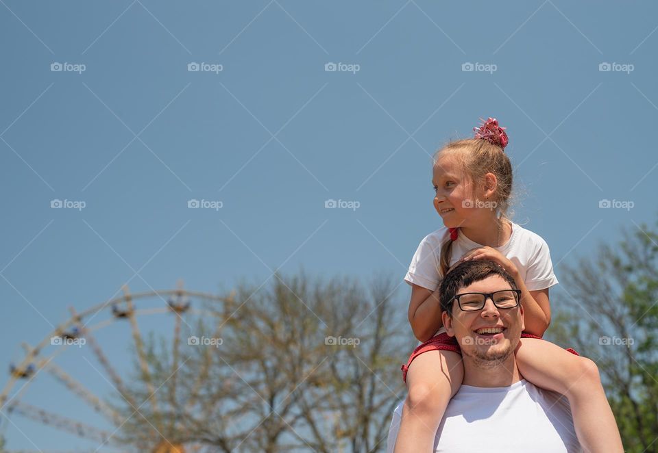 Happy father and daughter outdoors having fun