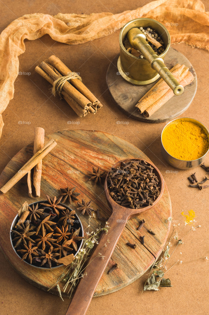Flatlay of assorted Indian spices.