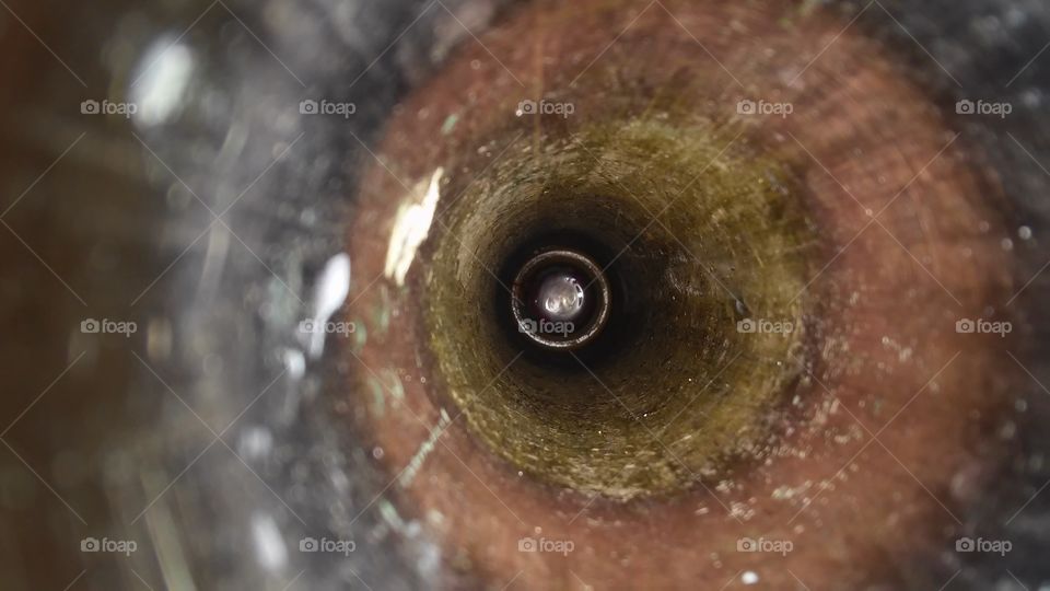 Lost. Looking down a drain pipe