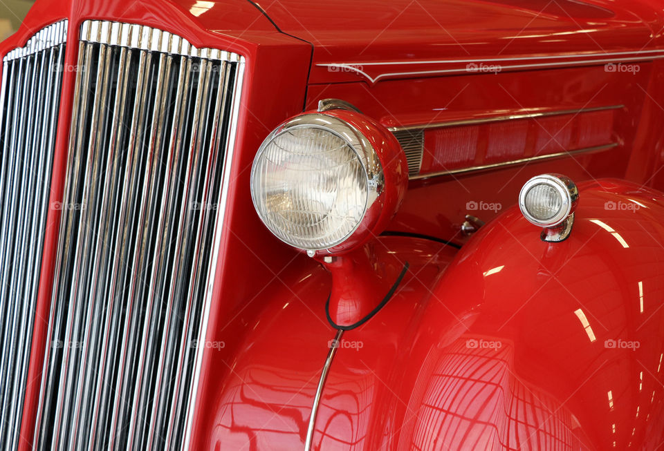 The front of an antique vehicle