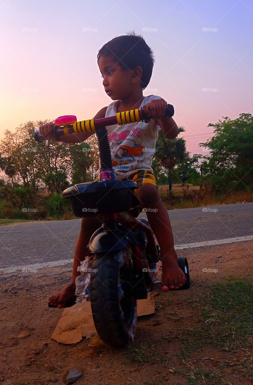 kid riding cycle