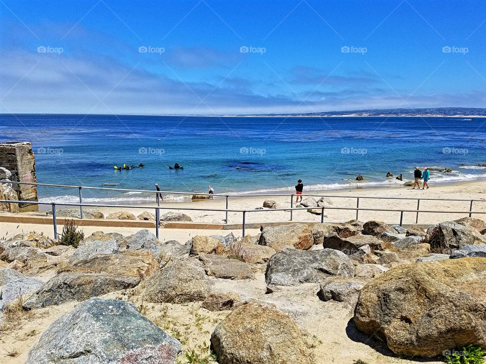 Let the vacation begin with a stroll along the rocky coastline,  watching the scuba divers in the water!