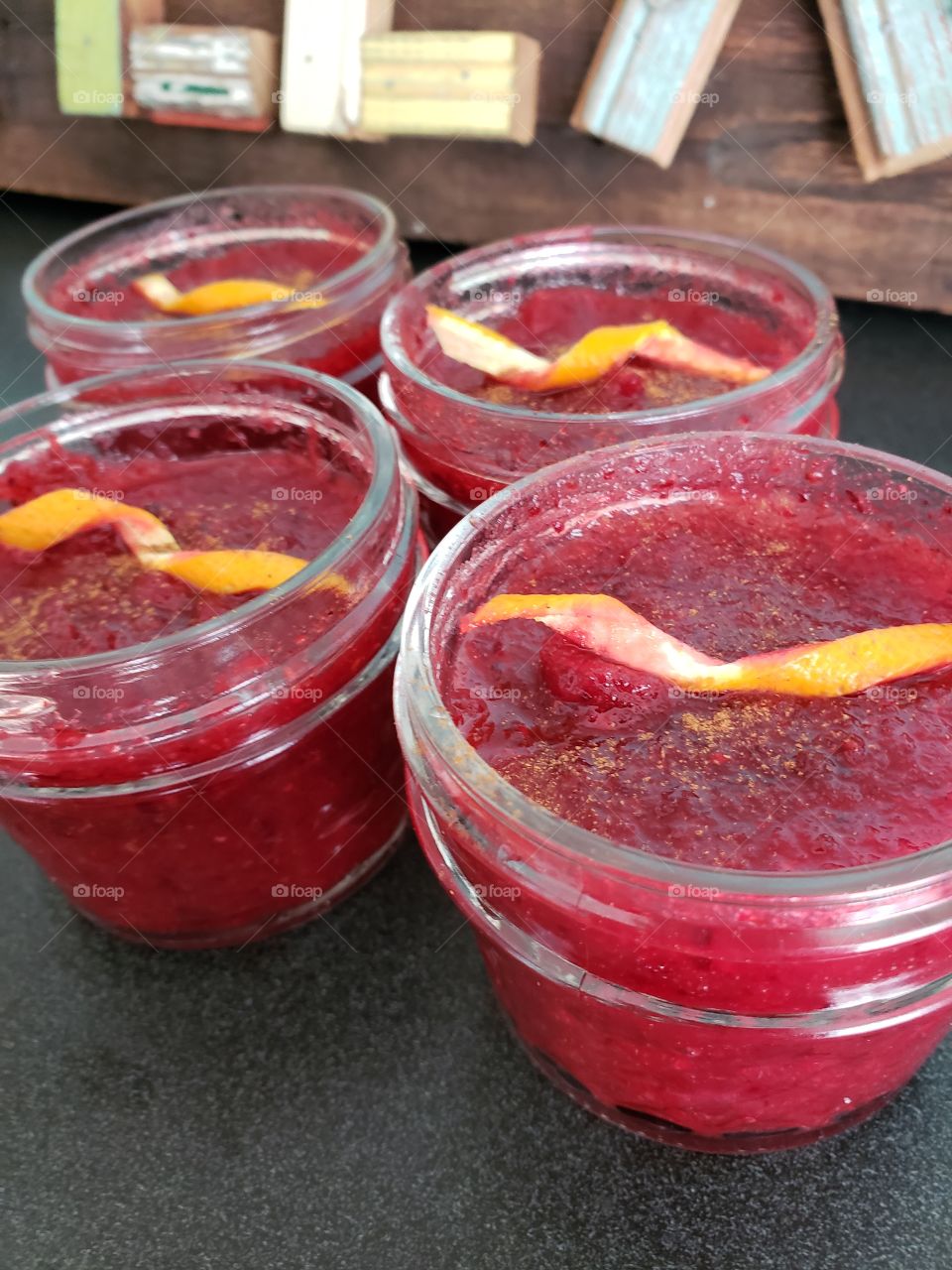 Fresh homemade fermented cranberry sauce with an orange zest and cinnamon.