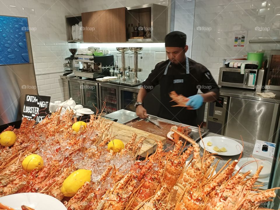 A big serving of lobsters at a seafood buffet restaurant.