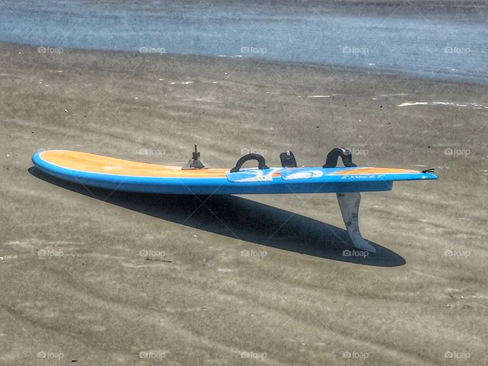 Surfboard on beach