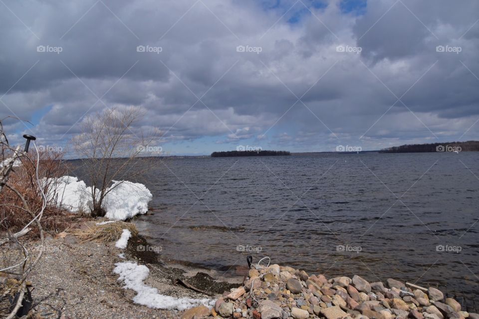 Spring has arrived but  cooler temps seem to be the normal. Lake finally broke up. Piles of ice brought in by the wind slowly melting and drifting out. 
