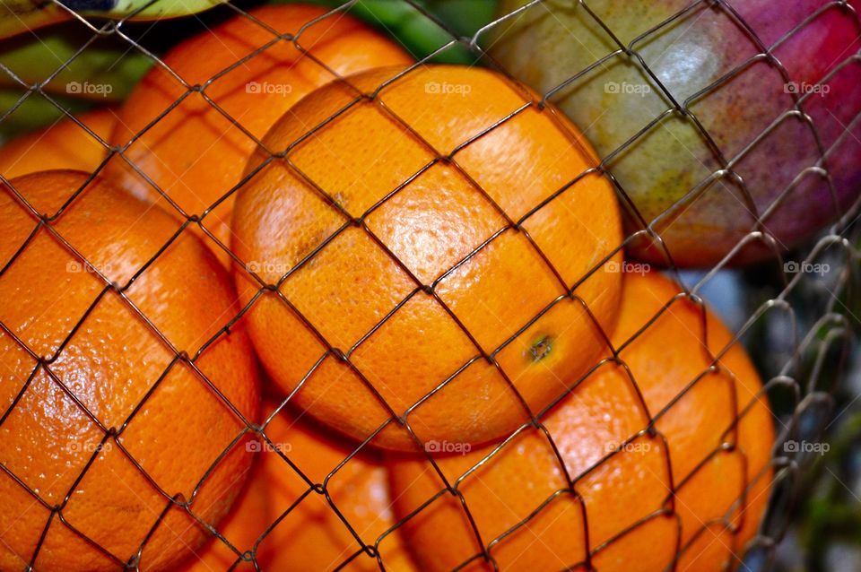 Oranges in chicken wire basket
