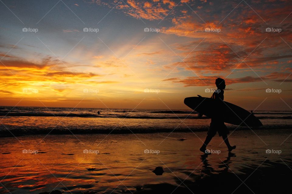 sunset and surfer