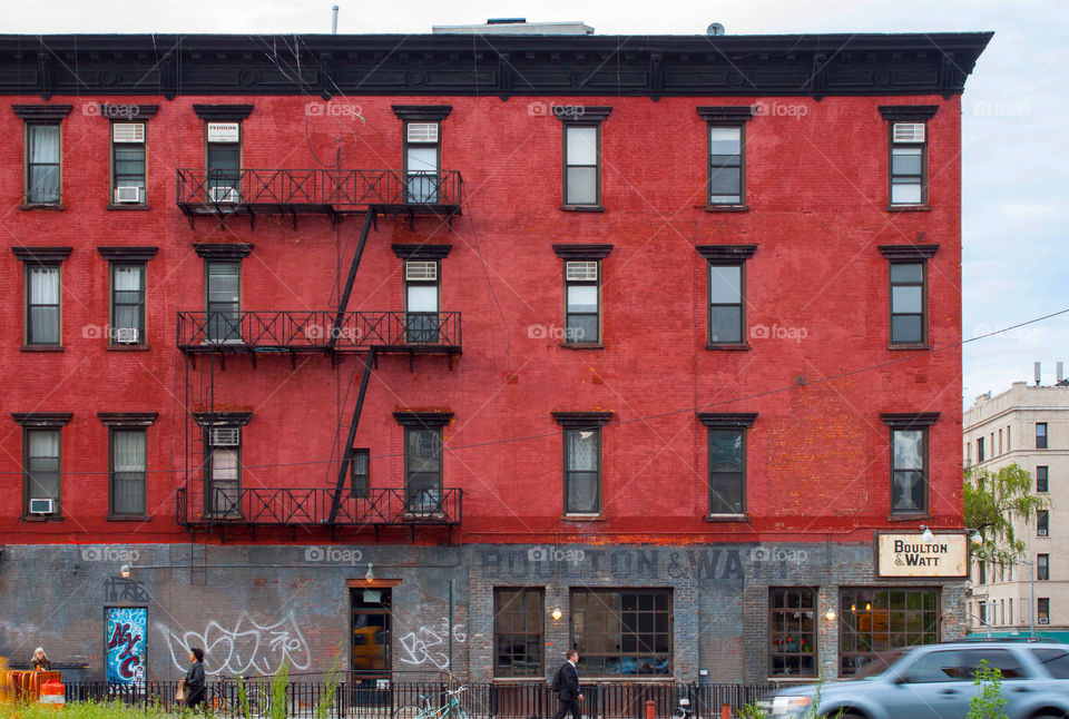 Red House In New York City With The Typical Fire Escapes