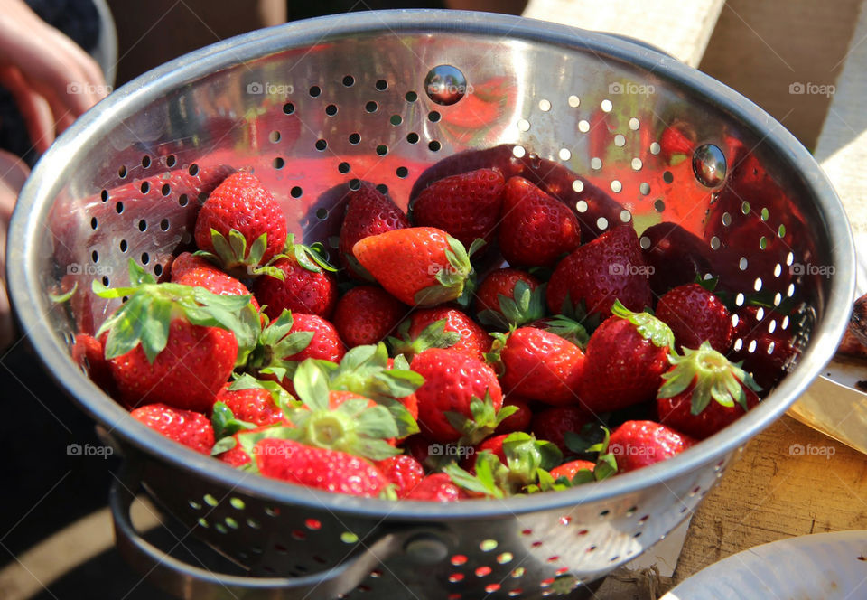 Strawberries in a metalic bowl