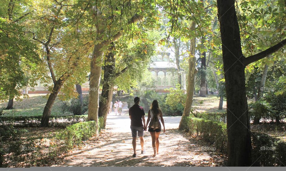 young couple escaping the summerheat.
Parque del Buen Retiro. Madrid, Spain.