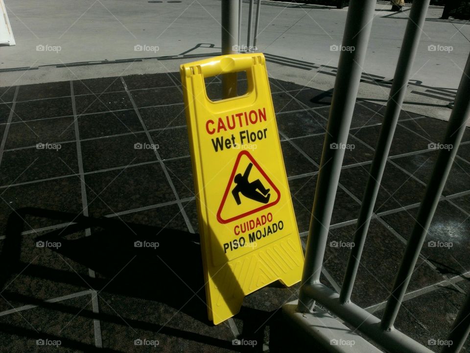 Caution Sign. A yellow caution sign surrounded by black and white.