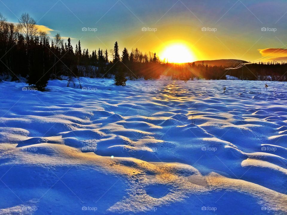 Sunset in snowy landscape